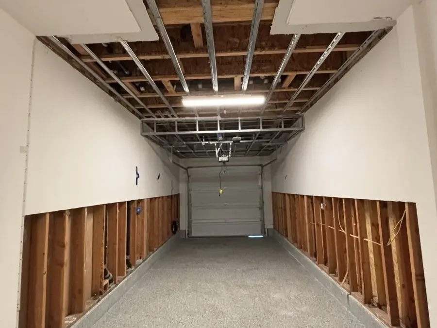 Garage walls with flood cuts after a water heater leak
