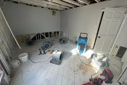 Drying equipment set up in a home during a water damage dry-out